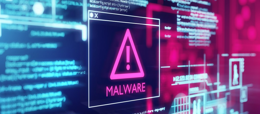 A computer screen with program code warning of a detected malware script program.
